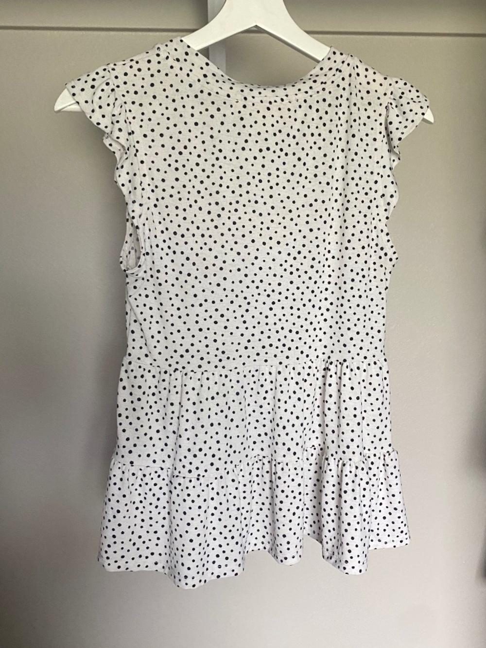 Small, black and white polka dotted Monteau shirt